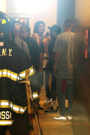 Kylie and Kendall Jenner rescued by firefighters after they get stuck in a lift